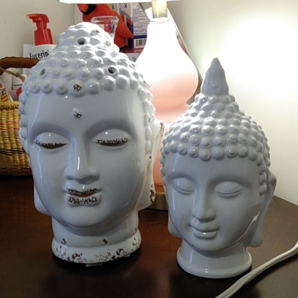 2 Budda Heads. Both Ceramic. One holds a Tealight